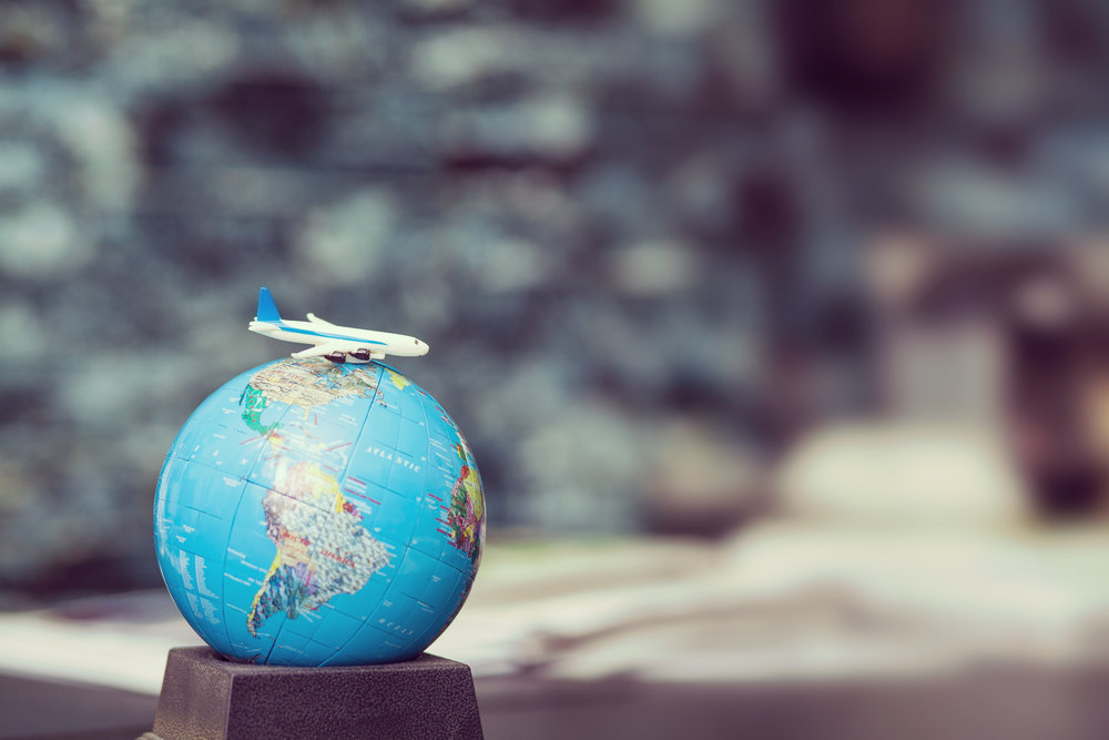 Miniature globe and little plane.